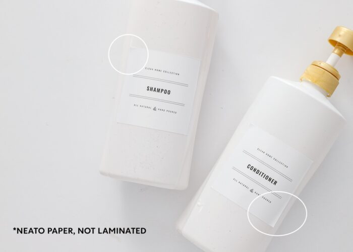 Shampoo and conditioner bottles labeled with Neato Waterproof paper.