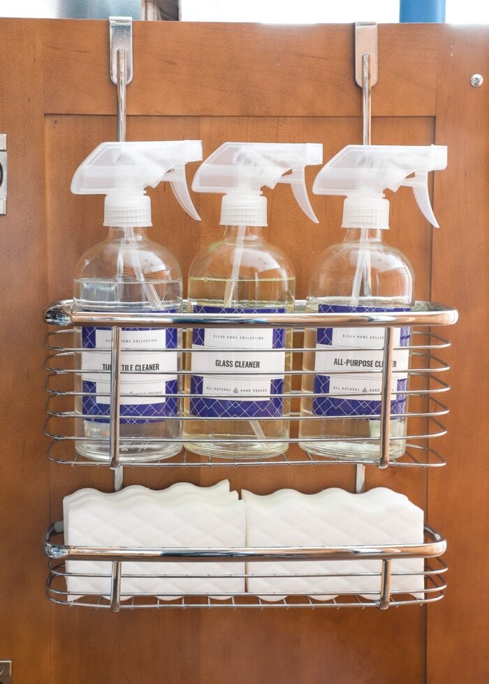 Cleaning supplies on over-the-door organizer.