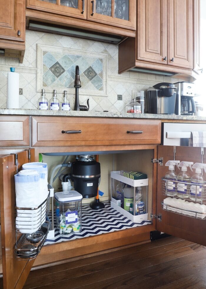 A perfectly organized cabinet under the kitchen sink.