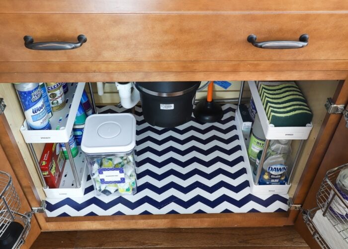 A perfectly organized cabinet under the kitchen sink.