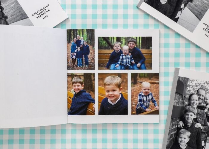 Open Family Yearbooks on a turquoise plaid background.