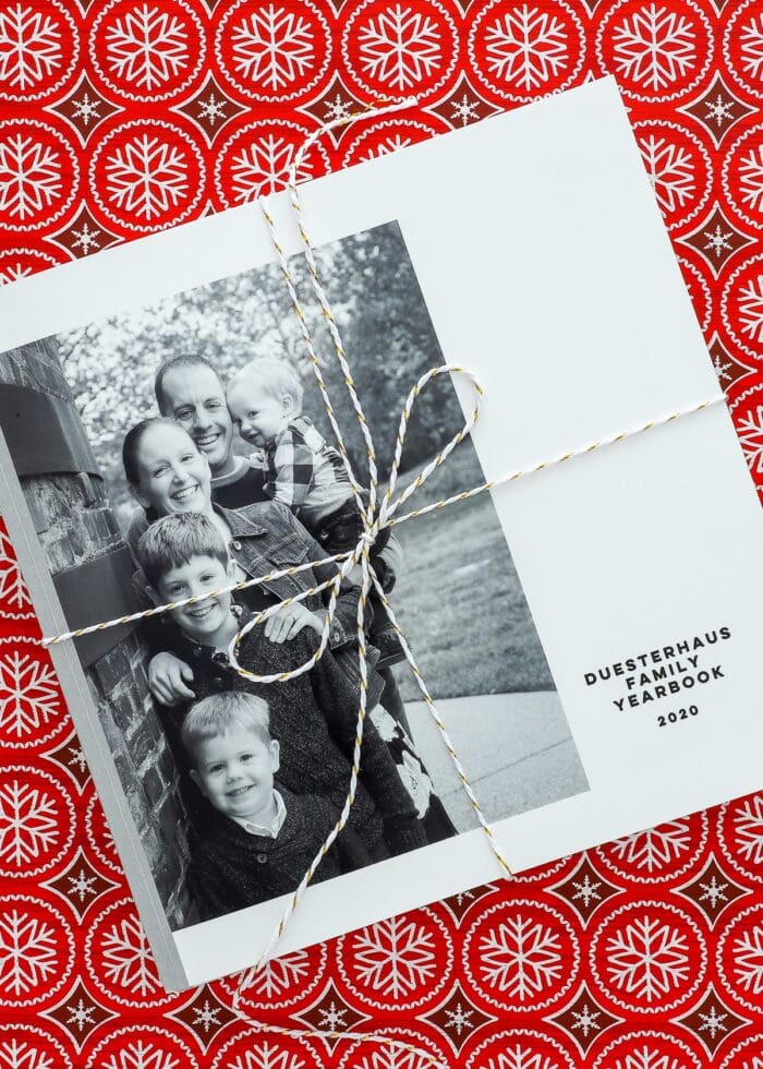 Black-and-white Family Yearbook on a red Christmas background.