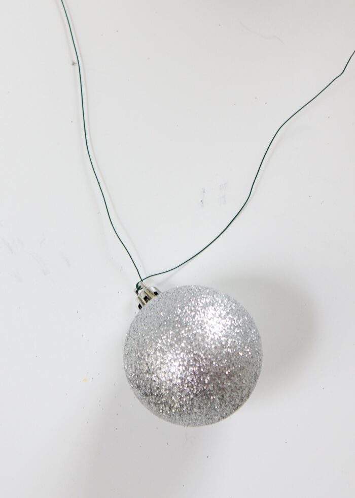 Silver ornament on floral wire.