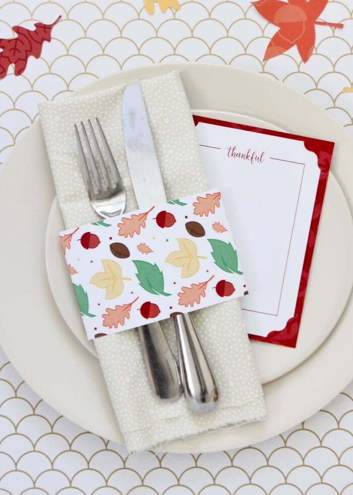 Printable Thanksgiving napkin ring around beige napkin.