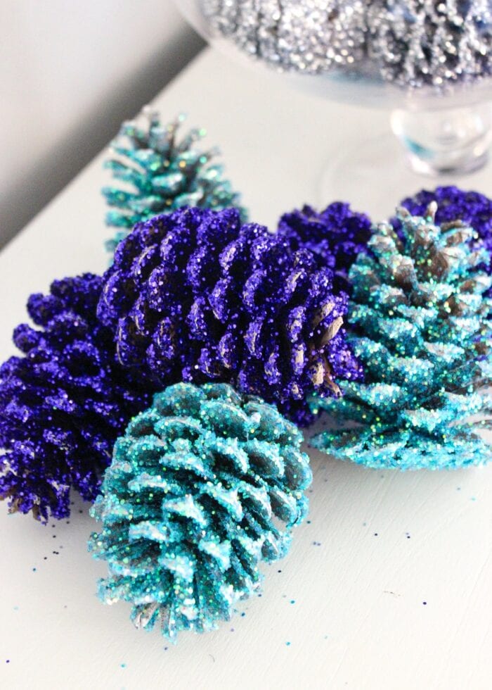 Navy and turquoise glittered pinecones.