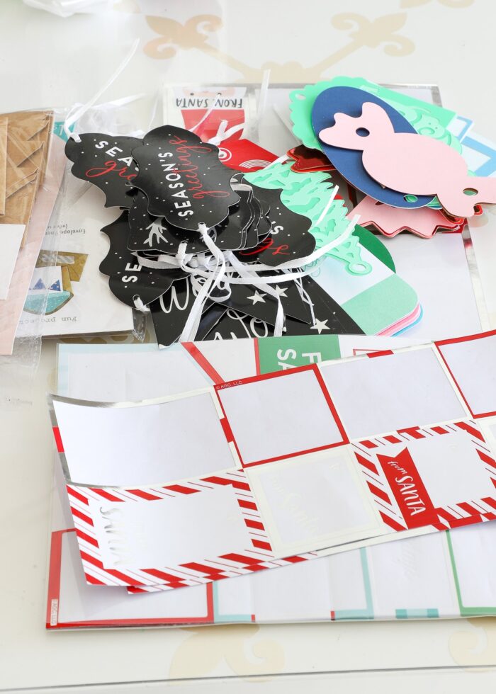 Mess of paper gift tags on a white table