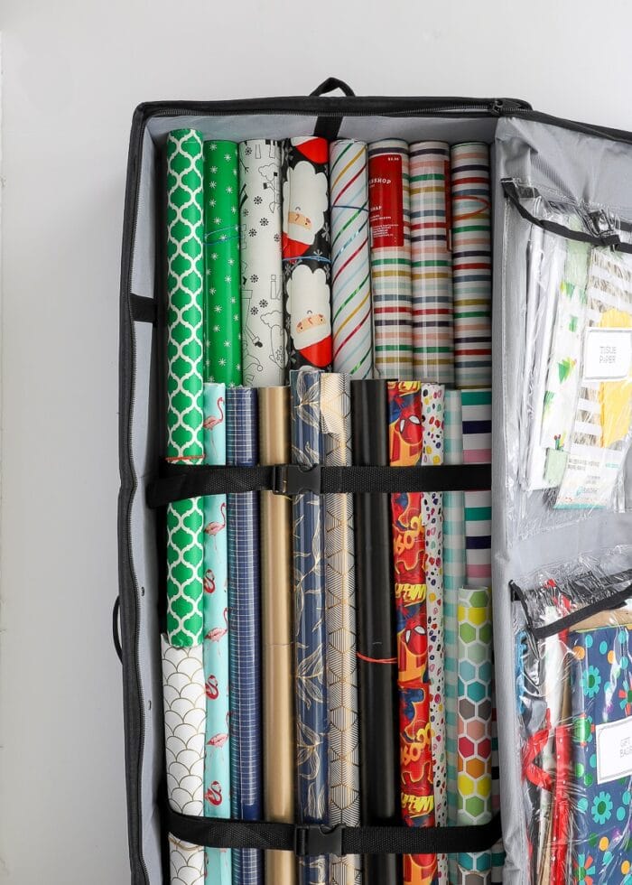 Gift wrapping supplies stored in a wrapping paper storage tote
