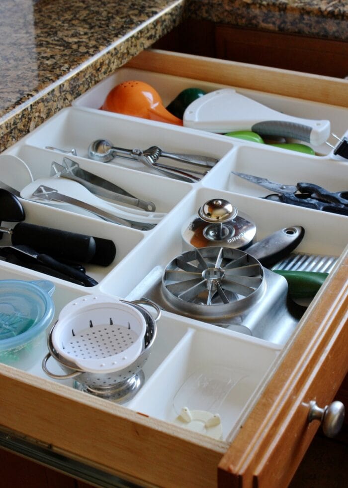 Kitchen drawer organized with white dividers