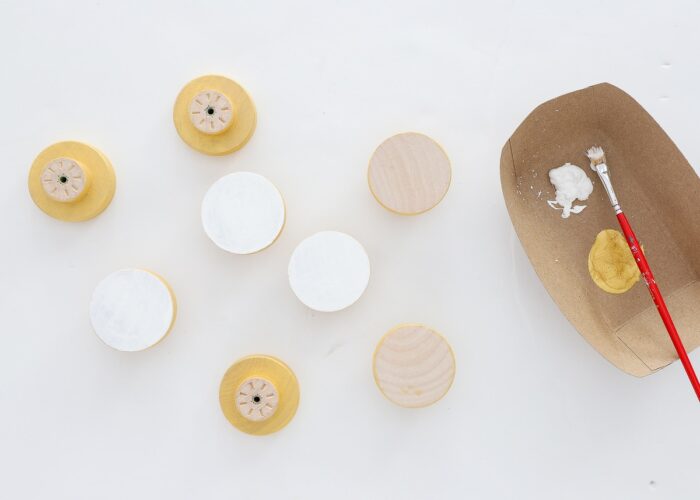 Wooden drawer knobs painted with white and gold paint
