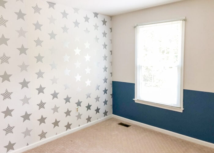 Navy blue and white bedroom with star wallpaper