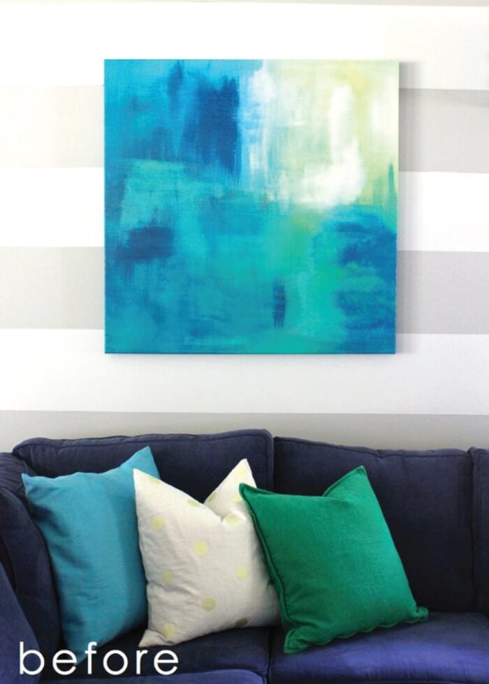 Blue and yellow canvas art on striped wall