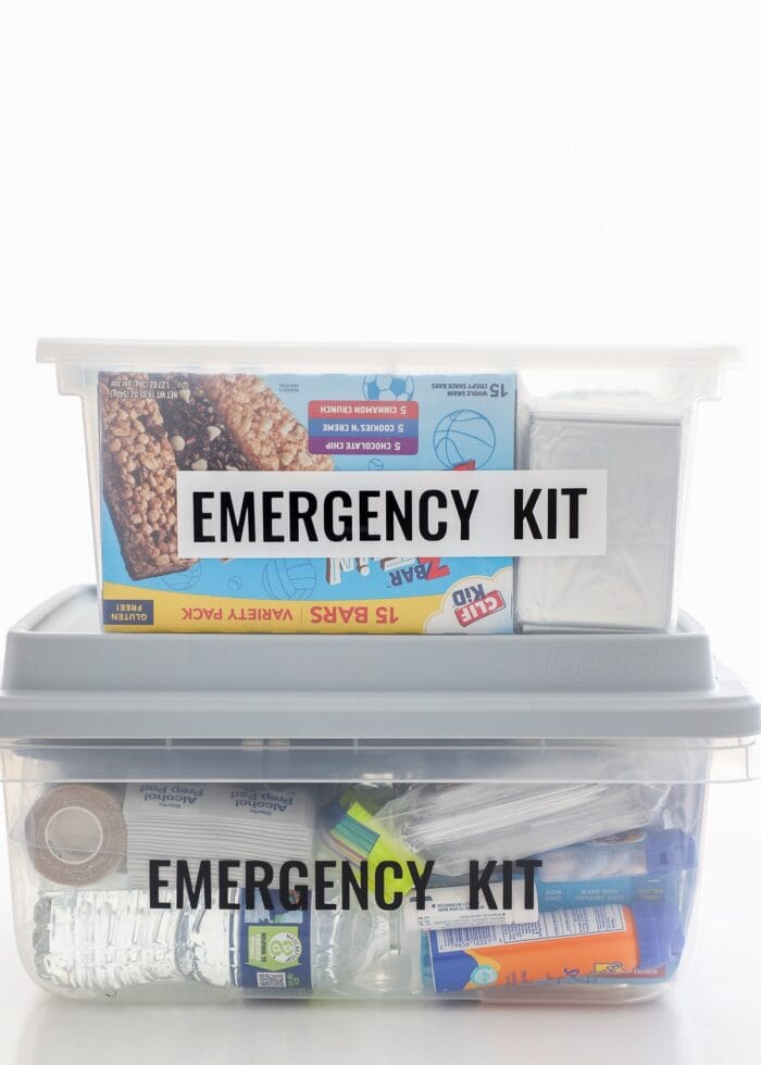 2 plastic boxes holding Car Emergency Kit supplies