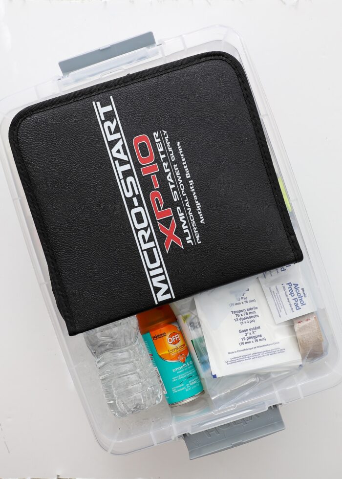 Plastic box holding Car Emergency Kit supplies