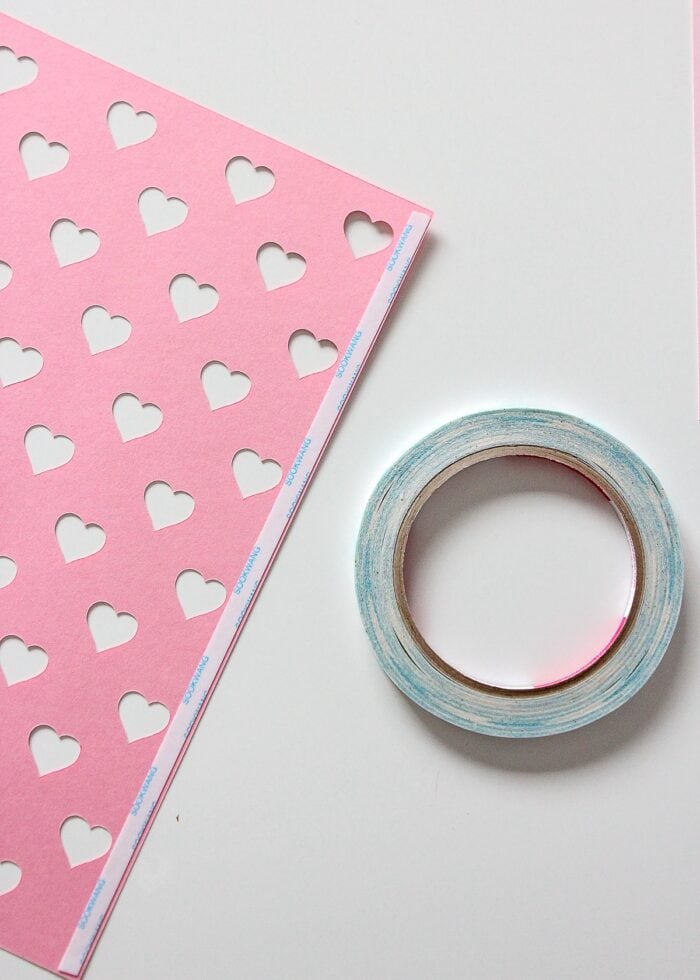 Tape on edge of Valentine vase paper design