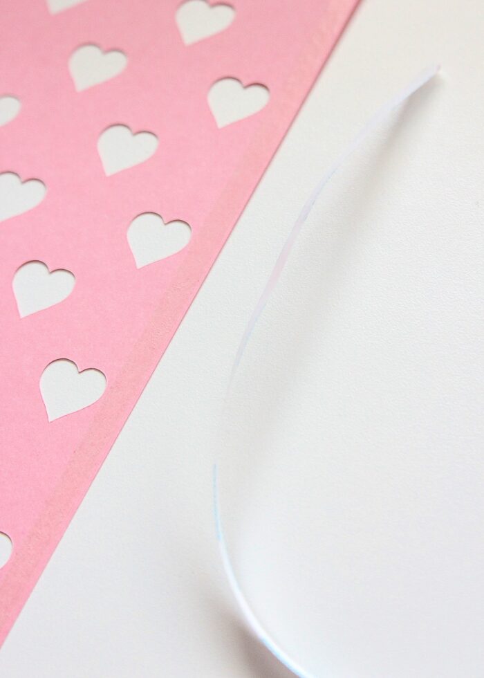 Tape on edge of Valentine vase paper design