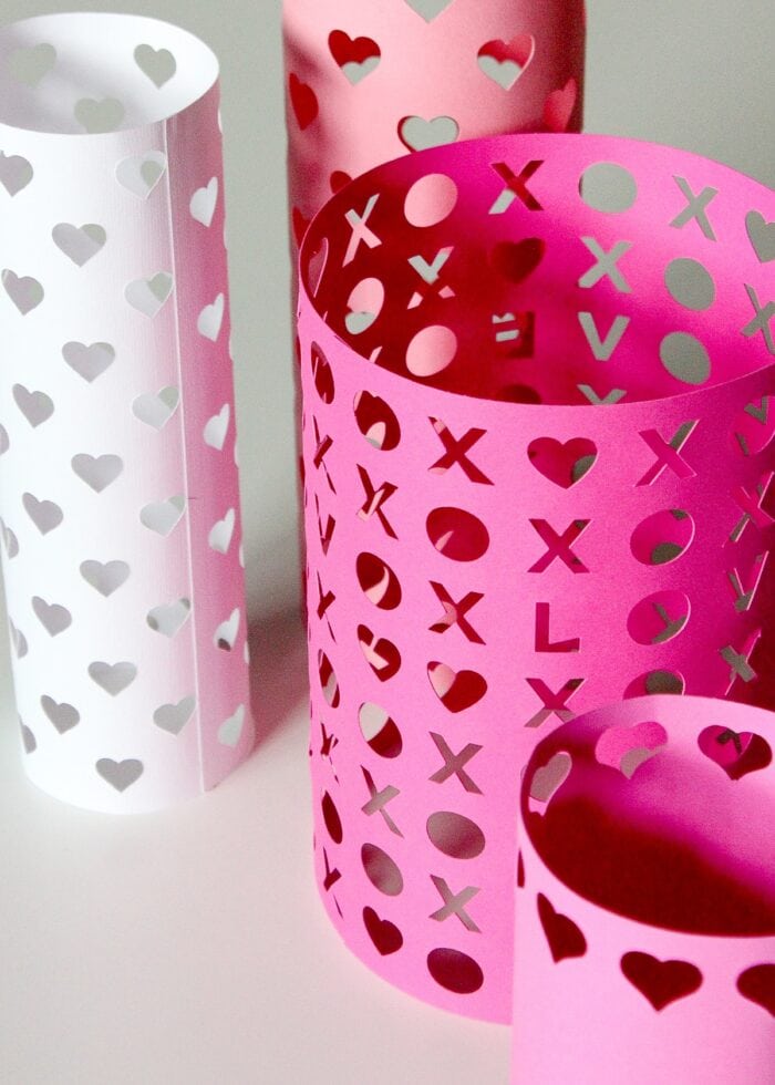 Paper Valentines vases taped together and standing up on a white table