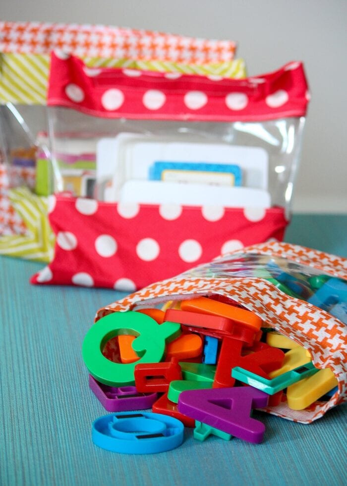 See-through toy bags holding small toys in a playroom