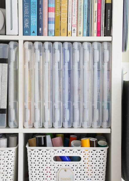 Clear document boxes on white shelf