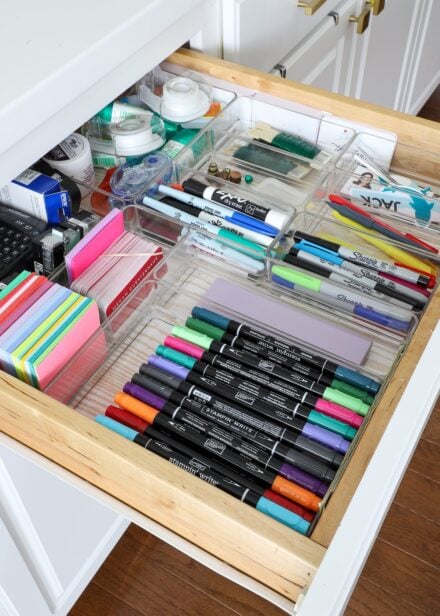 Office drawer holding markers and office supplies