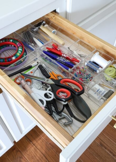 Drawer holding organized sewing supplies