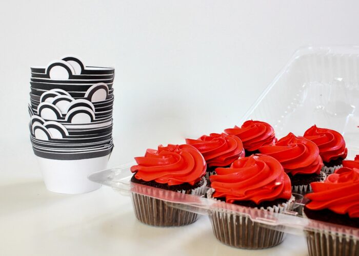 Red cupcakes with pokeball paper wrappers