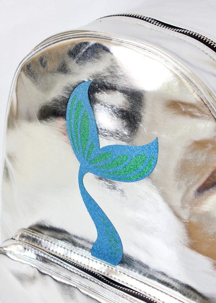 Mermaid tale made of glitter vinyl on a silver backpack