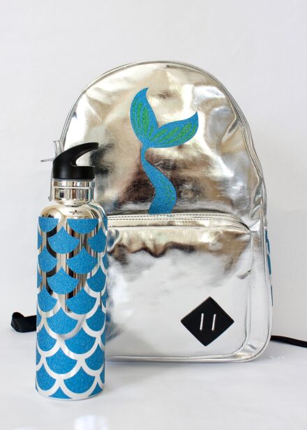 Mermaid scales made of glitter vinyl on a silver backpack and waterbottle