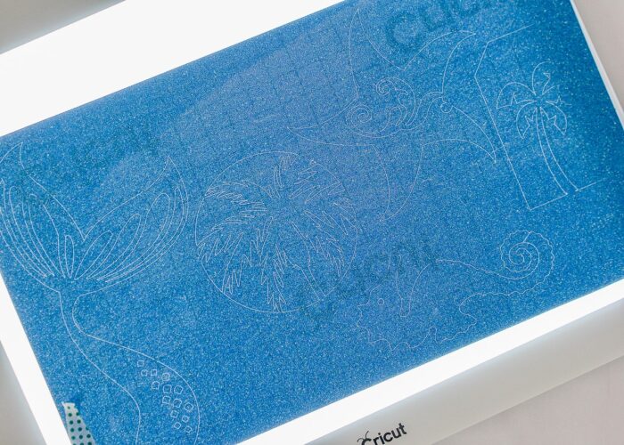 Blue glitter vinyl on top of Cricut Bright Pad