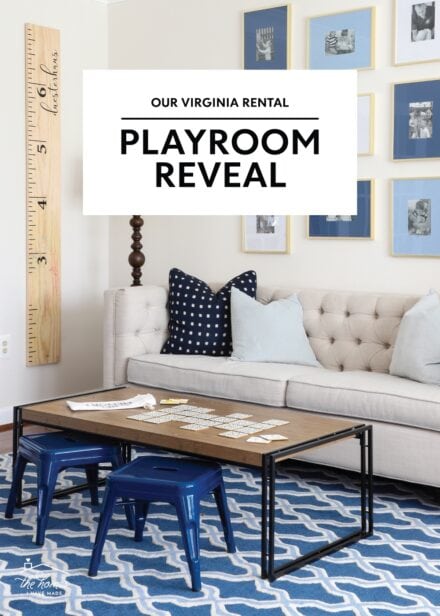 Blue and white playroom with couch and toy storage shelves