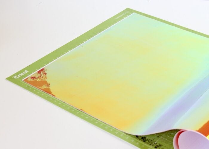 Cricut Holographic Vinyl laying on a green Cricut mat