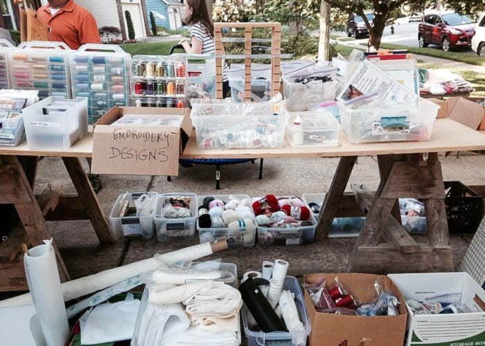 Tables of craft supplies at a craft sale