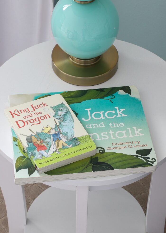 Kids books on white side table