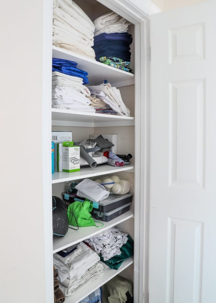 A linen closet getting ready for professional packers