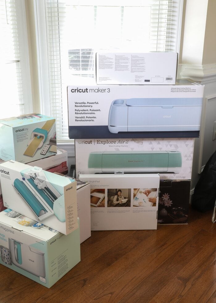 A stack of Cricut machines in boxes