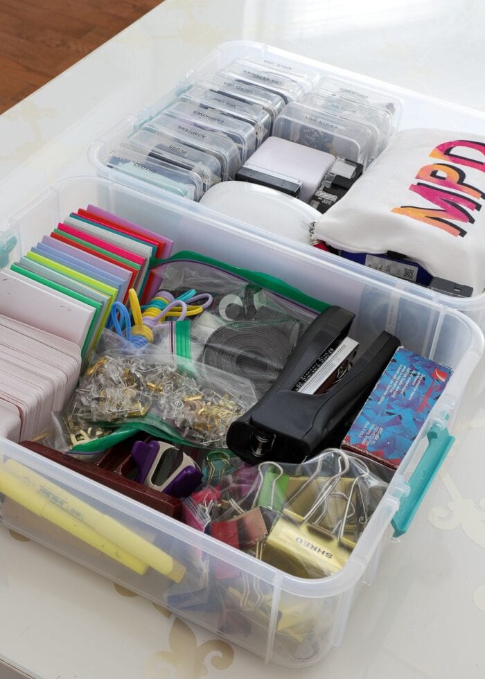 Office supplies loaded into baggies and bins