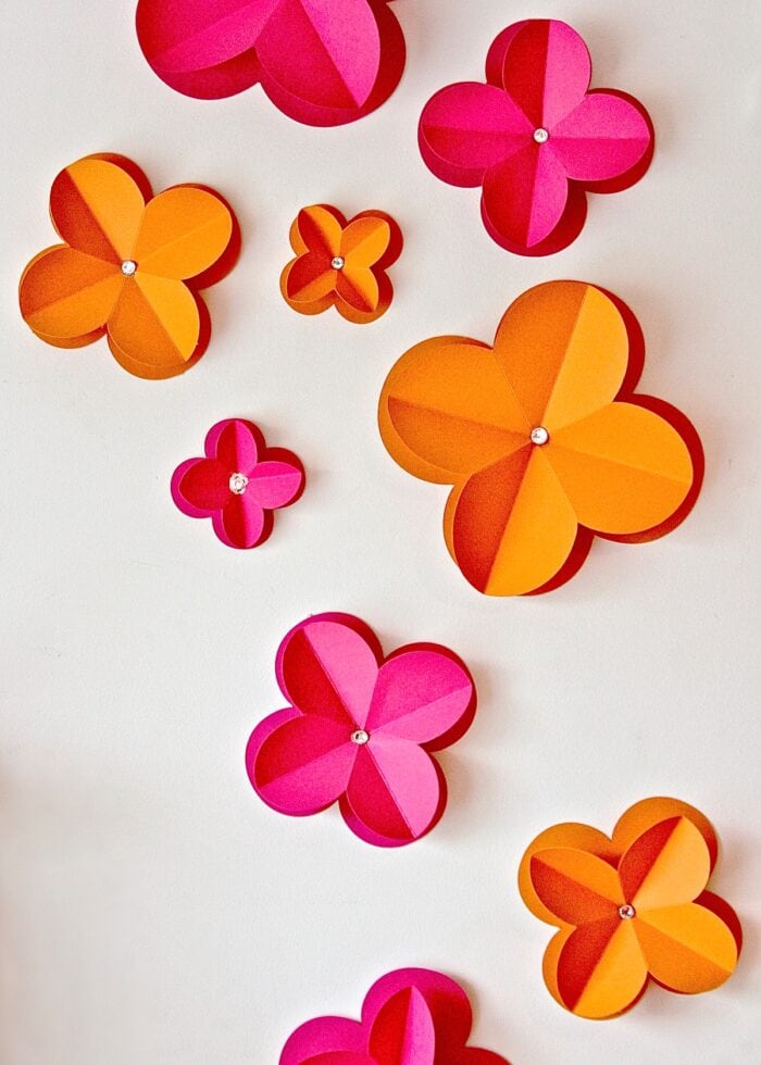 Orange and Pink 3D Paper Flowers on a white wall