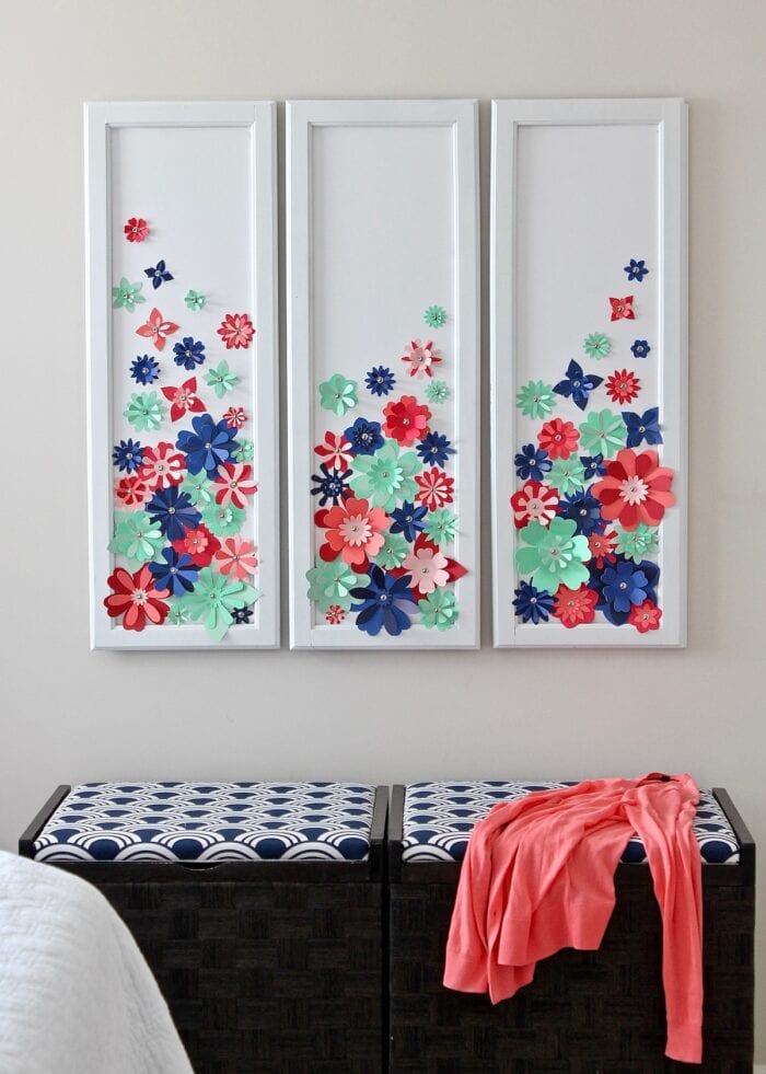 Red, blue, and green 3D flowers in a white frame