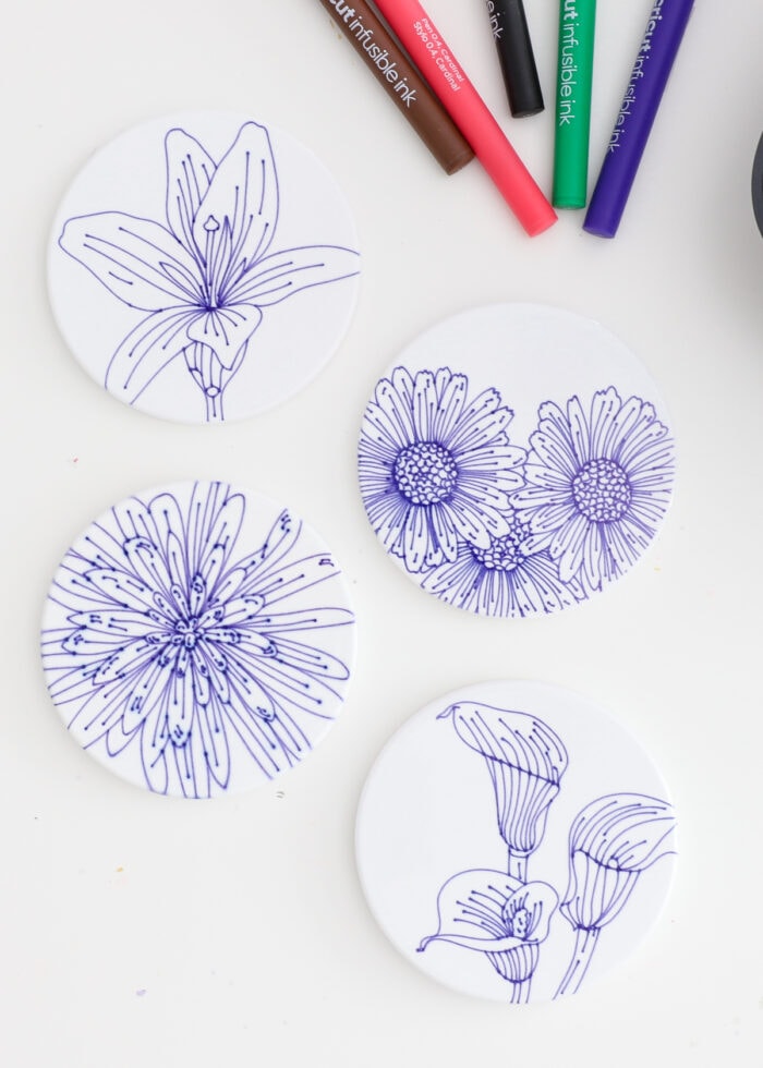 Flower coasters made with blue Cricut Infusible Ink Pens
