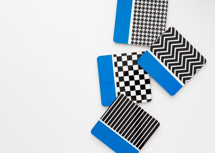 Blue, white, and black coasters made with Infusible Ink Transfer Sheets