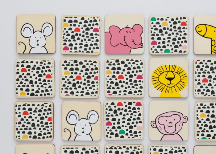 DIY Memory Game with colorful animal faces on wooden tiles