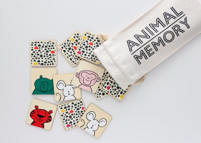 DIY Memory Game with colorful animal faces and a drawstring tote bag