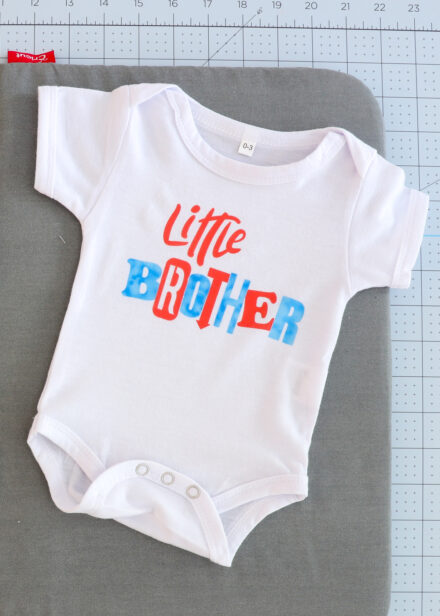 Baby onesie with words created by Cricut Infusible Ink