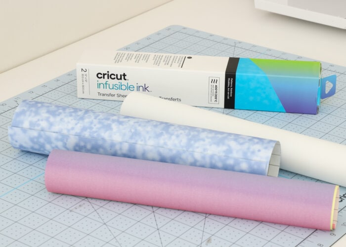 Cricut Infusible Ink Transfer Sheets unboxed on a cutting mat