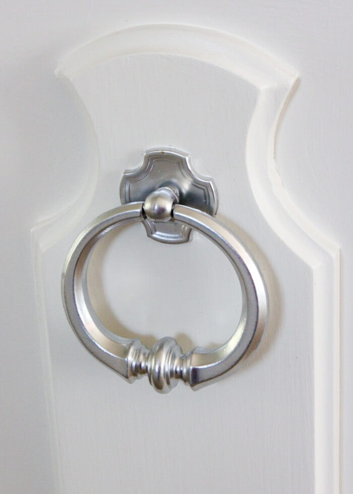 A brass handle spray painted silver