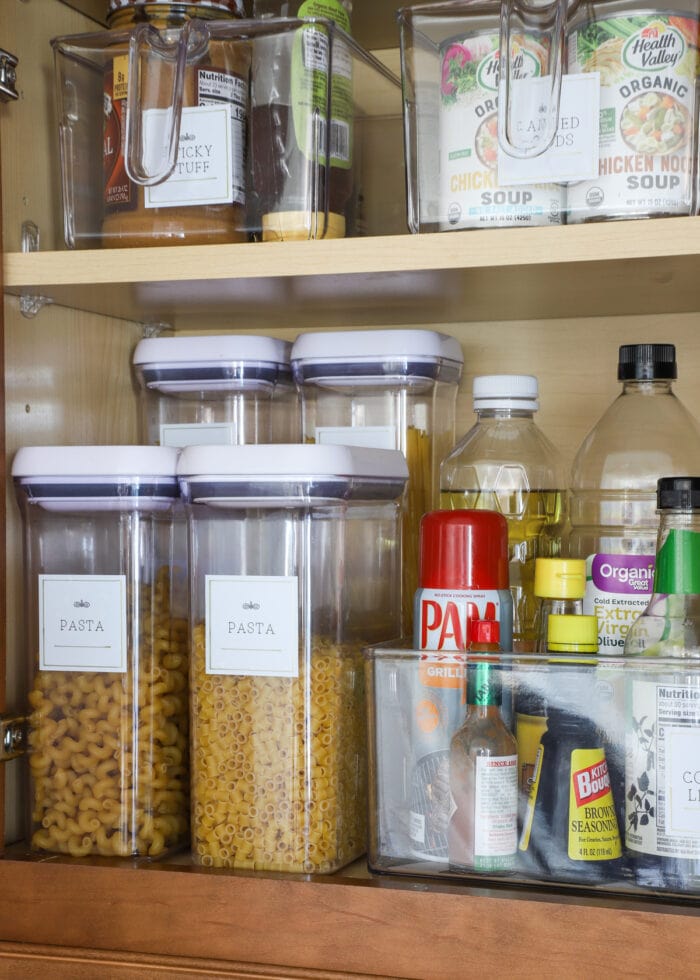 Pantry shelves with bins of food