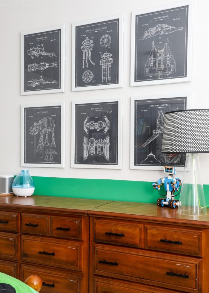 Star Wars blue prints framed and hung above wooden dressers