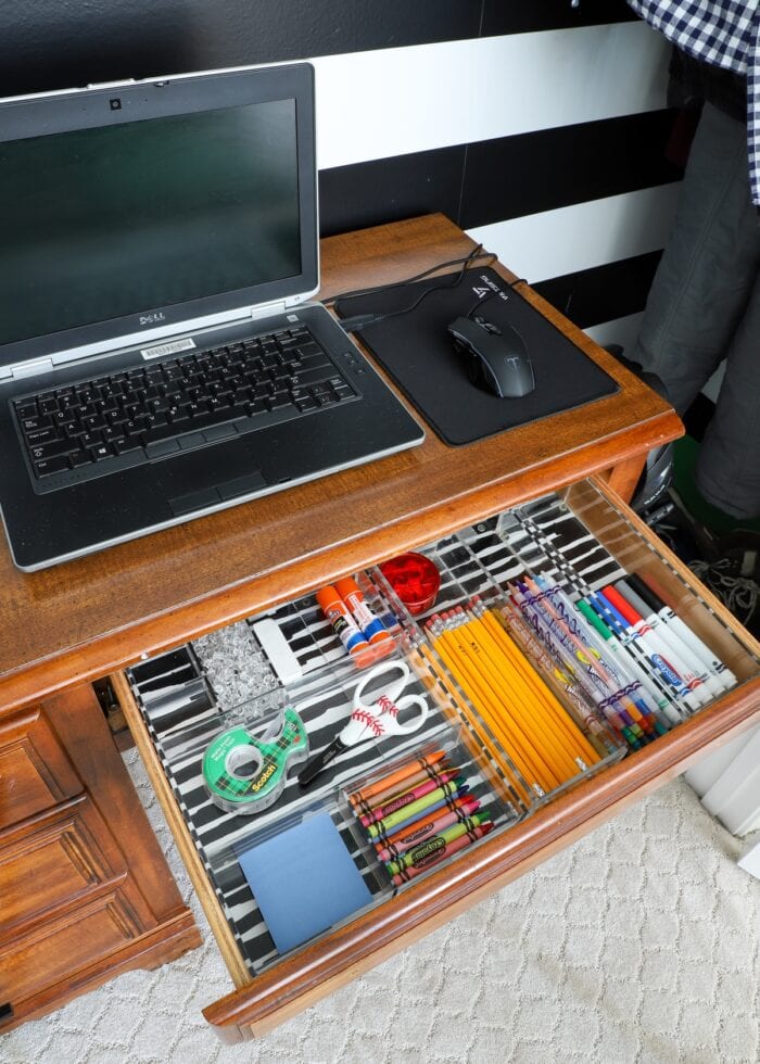 Desk with supply drawer open