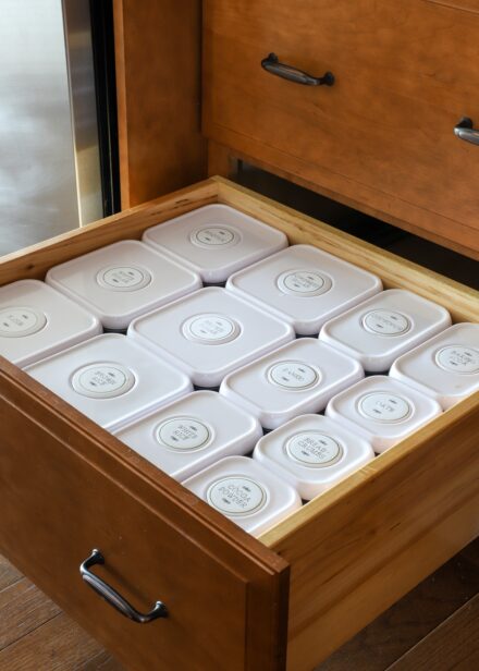 Kitchen drawer holding Oxo containers of pantry staples