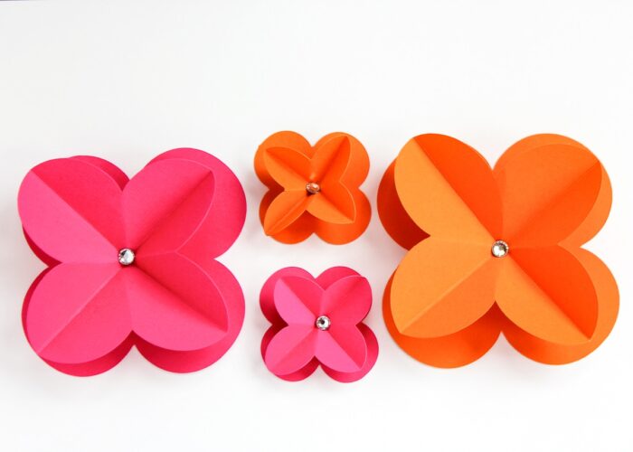 Four pink and orange 3D paper flowers