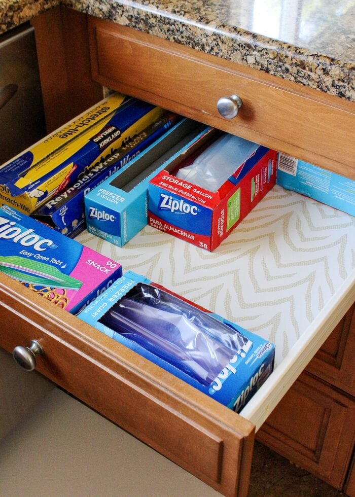 A kitchen drawer holding boxes of Ziplock bags